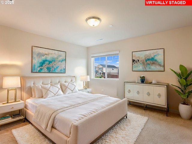 carpeted bedroom with visible vents