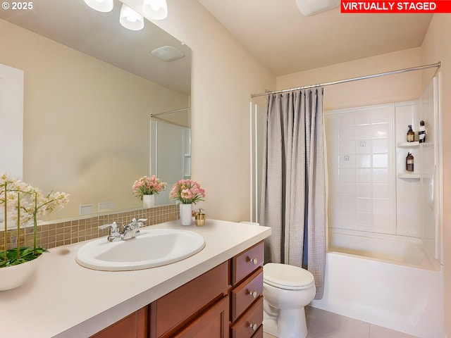 full bath with tile patterned flooring, toilet, vanity, and shower / bath combination with curtain