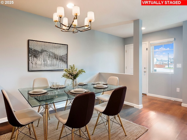 dining room featuring recessed lighting, wood finished floors, baseboards, and a chandelier