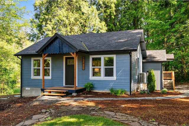 91822 Rulyville Rd, Westport, OR 97016 - view of front of home featuring a shingled roof and ac unit