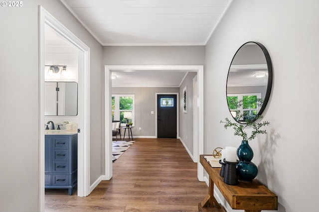 91822 Rulyville Rd, Westport, OR 97016 - entrance foyer with wood finished floors, baseboards, and ornamental molding