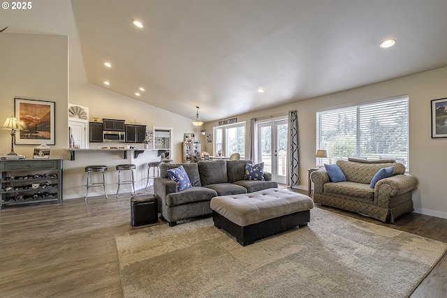 10764 Wiseacre Ln NE, Aurora, OR 97002 - living room featuring wood finished floors, recessed lighting, lofted ceiling, and baseboards