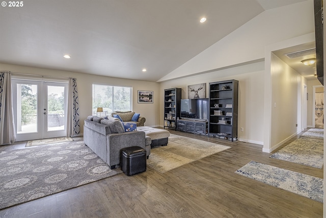10764 Wiseacre Ln NE, Aurora, OR 97002 - living area featuring french doors, wood finished floors, baseboards, recessed lighting, and high vaulted ceiling