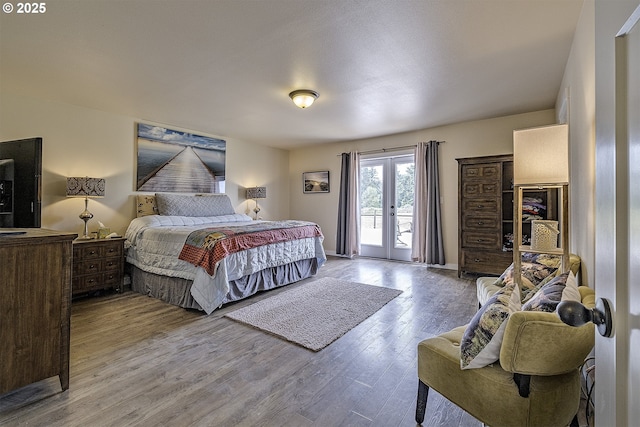 10764 Wiseacre Ln NE, Aurora, OR 97002 - bedroom with access to outside, wood finished floors, and french doors