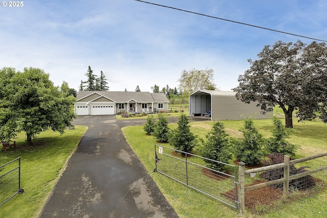 10764 Wiseacre Ln NE, Aurora, OR 97002 - view of front of home featuring driveway, a carport, and a garage