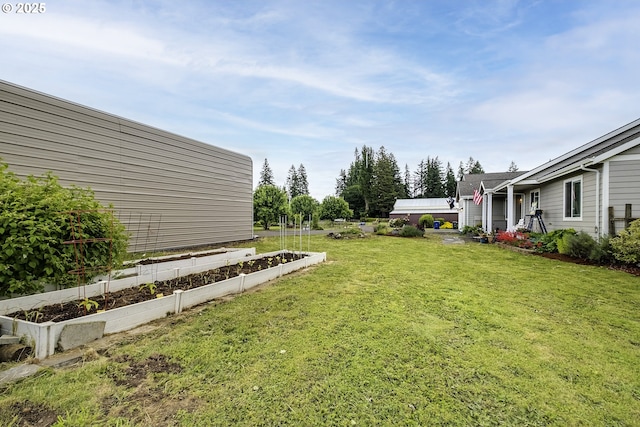 10764 Wiseacre Ln NE, Aurora, OR 97002 - view of grassy yard with a vegetable garden