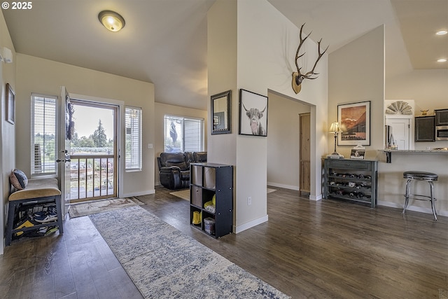 10764 Wiseacre Ln NE, Aurora, OR 97002 - entryway featuring dark wood-type flooring, baseboards, and high vaulted ceiling