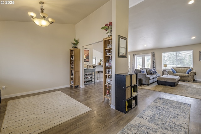 10764 Wiseacre Ln NE, Aurora, OR 97002 - living room featuring dark wood-style flooring, baseboards, a chandelier, and recessed lighting