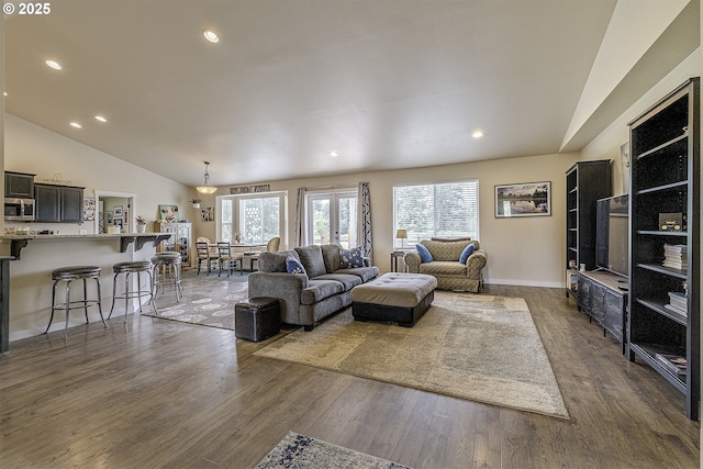 10764 Wiseacre Ln NE, Aurora, OR 97002 - living room featuring lofted ceiling, dark wood finished floors, recessed lighting, and baseboards