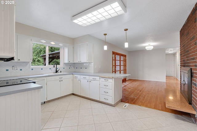 11184 S Allen Ct, Oregon City, OR 97045 - kitchen featuring a peninsula, light countertops, backsplash, dishwasher, and white cabinets