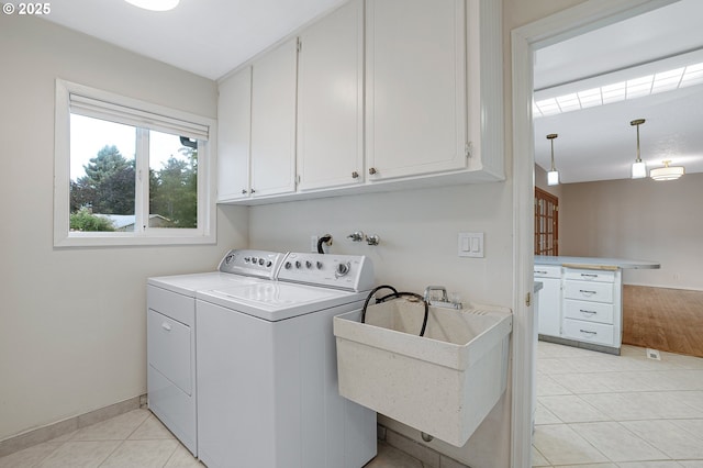 11184 S Allen Ct, Oregon City, OR 97045 - laundry room featuring cabinet space, washing machine and clothes dryer, and light tile patterned flooring