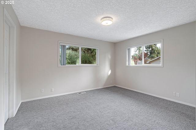 11184 S Allen Ct, Oregon City, OR 97045 - carpeted empty room featuring a textured ceiling and baseboards