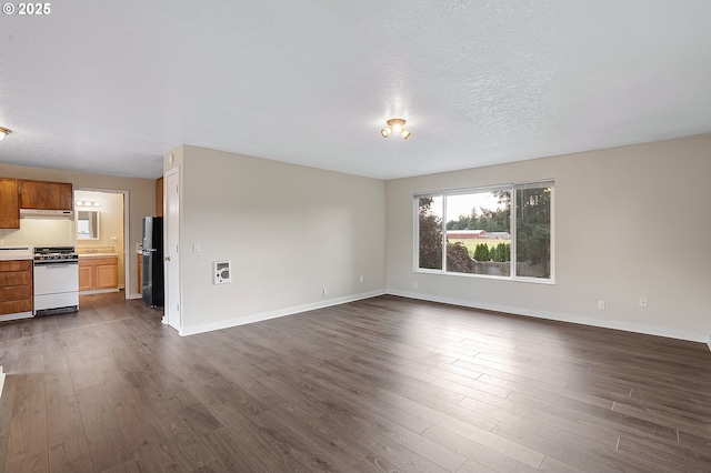 11184 S Allen Ct, Oregon City, OR 97045 - unfurnished living room with dark wood-type flooring and baseboards
