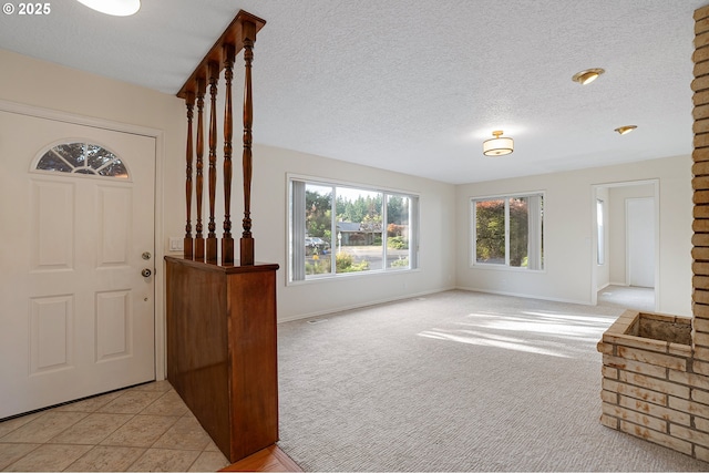 11184 S Allen Ct, Oregon City, OR 97045 - foyer entrance featuring a textured ceiling and light carpet