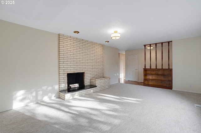 11184 S Allen Ct, Oregon City, OR 97045 - unfurnished living room with carpet flooring and a brick fireplace