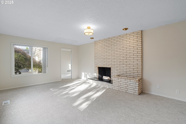 11184 S Allen Ct, Oregon City, OR 97045 - unfurnished living room featuring a brick fireplace, a textured ceiling, and carpet floors