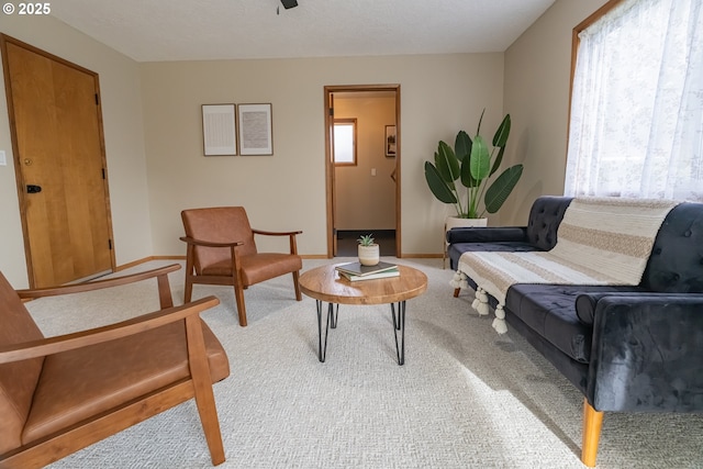 1185 NE Queens Ln, Hillsboro, OR 97124 - carpeted living room featuring baseboards