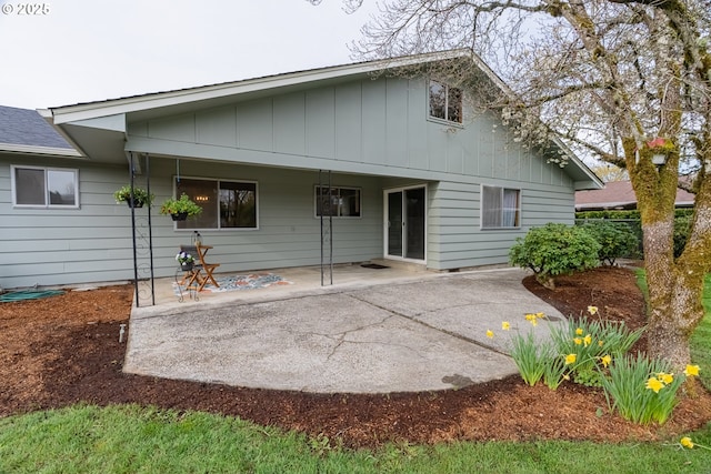 1185 NE Queens Ln, Hillsboro, OR 97124 - rear view of house with a patio area and board and batten siding