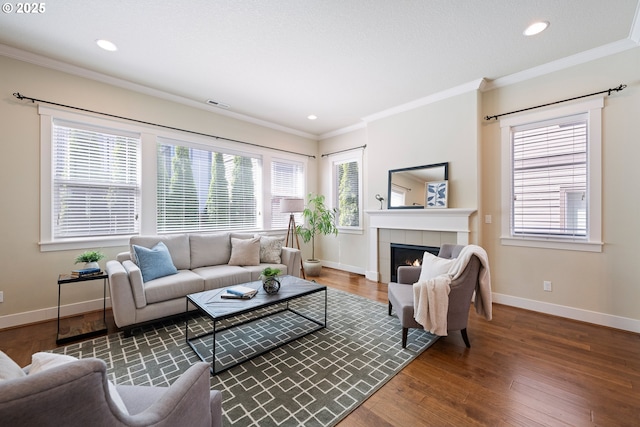 15152 NW Marie Way, Portland, OR 97229 - living room featuring crown molding, baseboards, wood finished floors, healthy amount of natural light, and recessed lighting