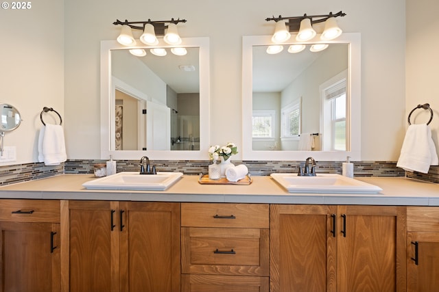 15152 NW Marie Way, Portland, OR 97229 - bathroom with double vanity and tasteful backsplash