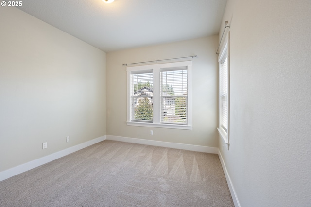 15152 NW Marie Way, Portland, OR 97229 - empty room featuring light colored carpet and baseboards