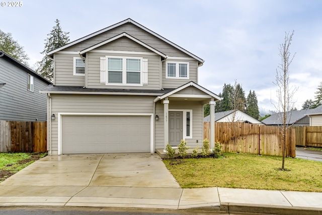 view of front of property with a garage and a front yard