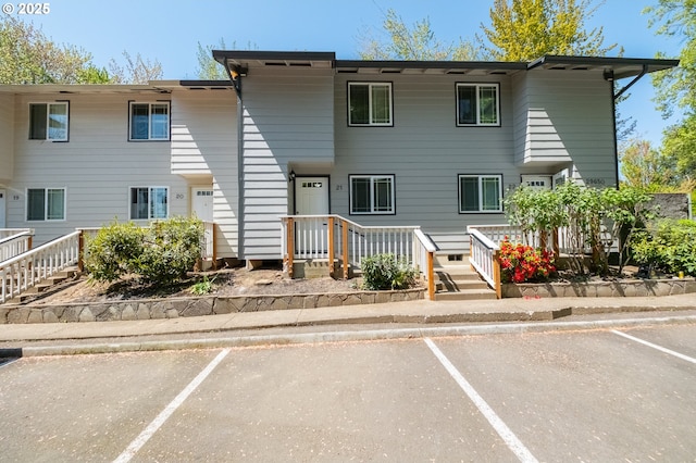 townhome / multi-family property with uncovered parking