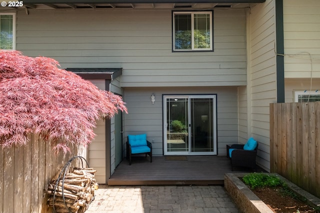 exterior space featuring a deck and fence