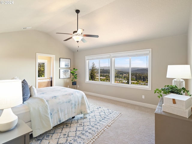 bedroom featuring lofted ceiling, light colored carpet, visible vents, a ceiling fan, and baseboards