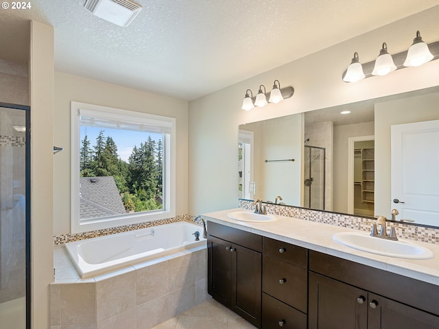 full bath with a garden tub, a stall shower, a sink, and visible vents