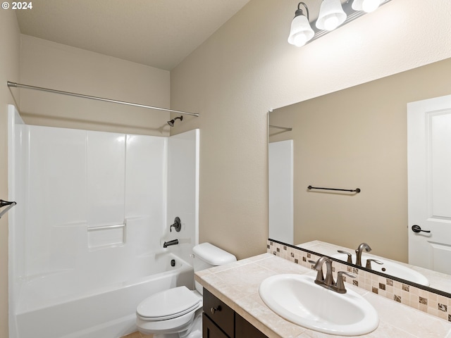 full bath with shower / tub combination, vanity, and toilet