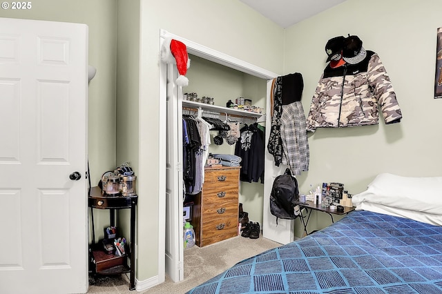 bedroom featuring light colored carpet and a closet