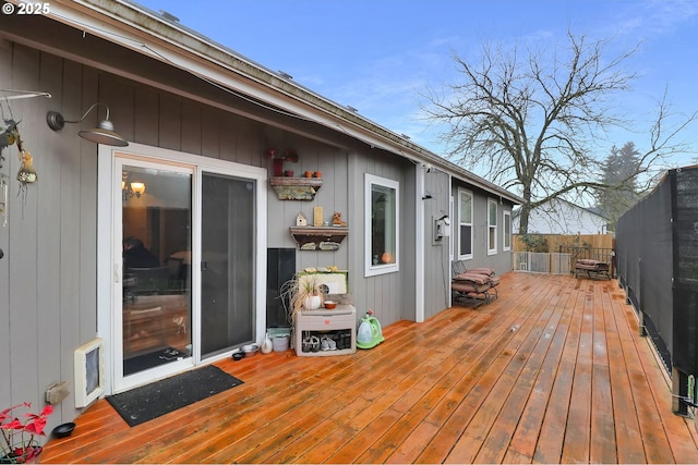 wooden terrace featuring fence