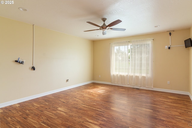 30258 King Ln, Hermiston, OR 97838 - empty room featuring ceiling fan, wood finished floors, and baseboards