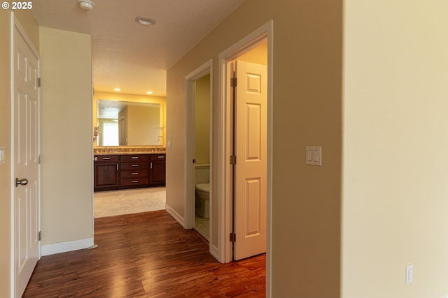 30258 King Ln, Hermiston, OR 97838 - hall with dark wood-style floors, baseboards, and recessed lighting