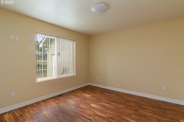30258 King Ln, Hermiston, OR 97838 - spare room with dark wood-type flooring and baseboards