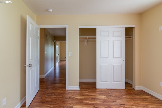30258 King Ln, Hermiston, OR 97838 - unfurnished bedroom with wood finished floors, a closet, and baseboards