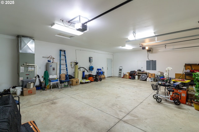 30258 King Ln, Hermiston, OR 97838 - garage with a garage door opener, water heater, and heating unit