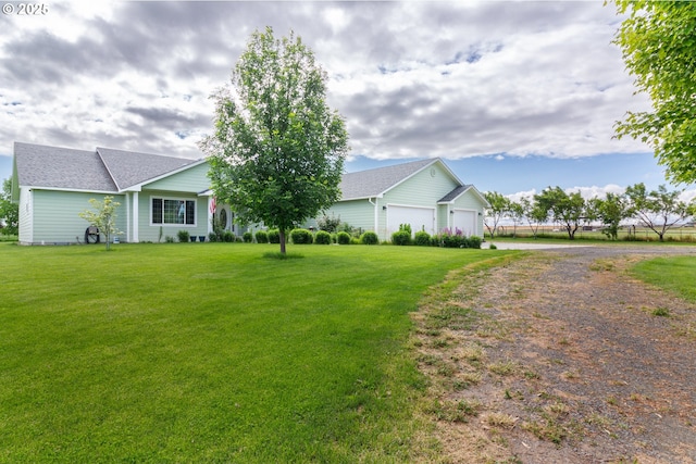30258 King Ln, Hermiston, OR 97838 - ranch-style house with driveway, a garage, a front lawn, and roof with shingles