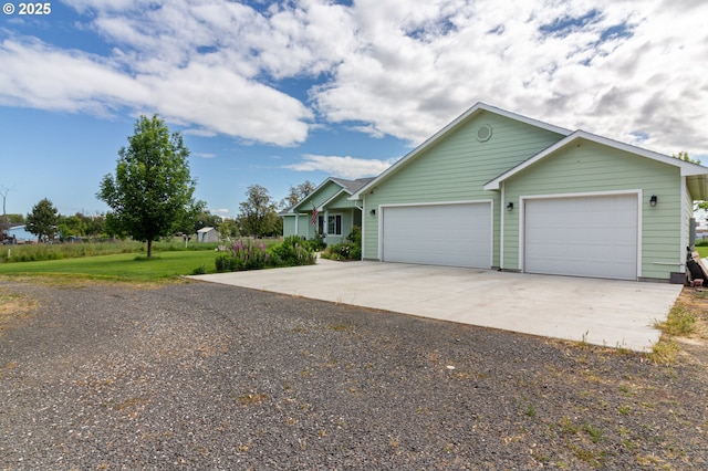 30258 King Ln, Hermiston, OR 97838 - view of front of house featuring concrete driveway and a garage