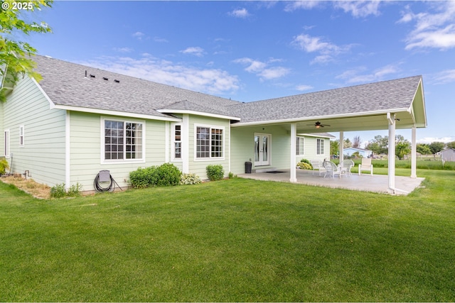 30258 King Ln, Hermiston, OR 97838 - rear view of house with a yard, a patio, roof with shingles, and ceiling fan