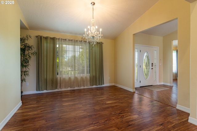 30258 King Ln, Hermiston, OR 97838 - entryway with healthy amount of natural light, wood finished floors, a chandelier, baseboards, and vaulted ceiling