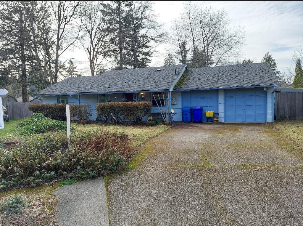 ranch-style house featuring a garage