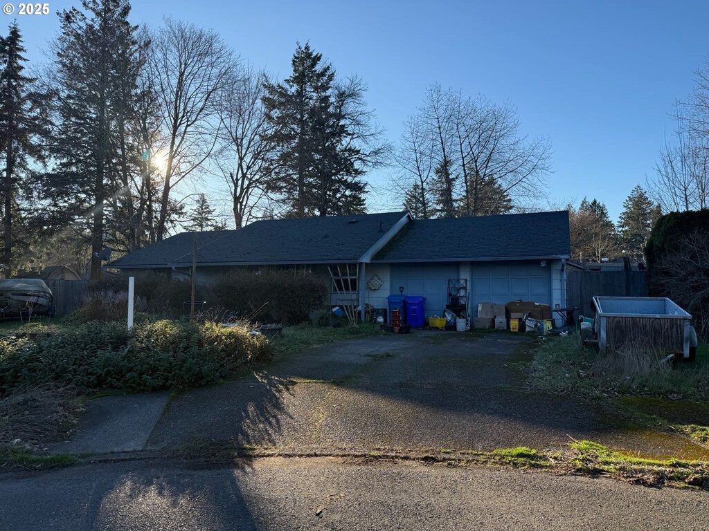 rear view of house with a garage