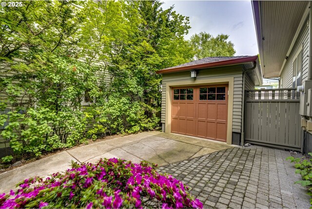 garage with concrete driveway