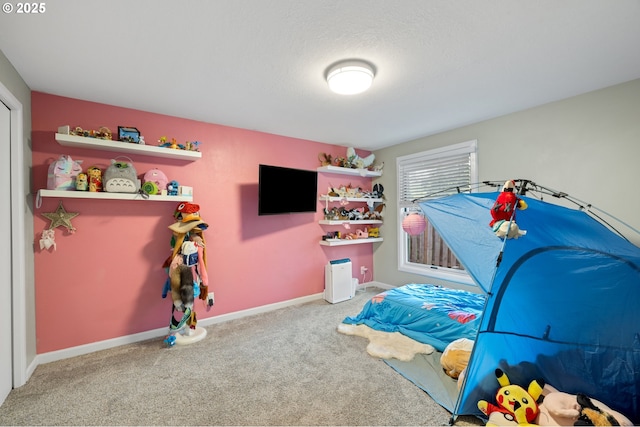 game room featuring carpet flooring and baseboards