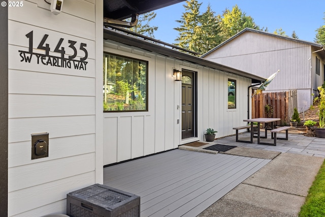 exterior space with fence and a wooden deck