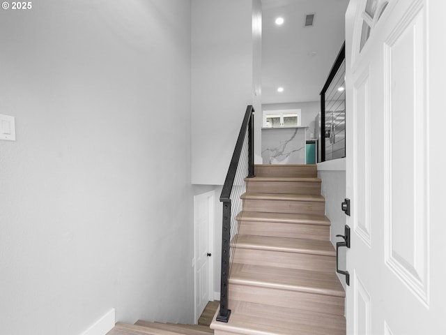 stairs featuring visible vents and recessed lighting