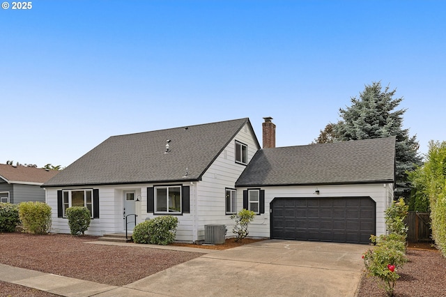 18090 NW Avalon Dr, Portland, OR 97229 - cape cod house with a garage, driveway, a chimney, and roof with shingles