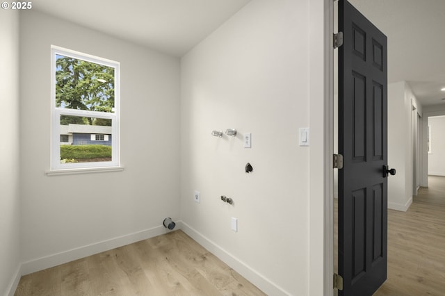 18090 NW Avalon Dr, Portland, OR 97229 - laundry room with hookup for an electric dryer and light wood-type flooring